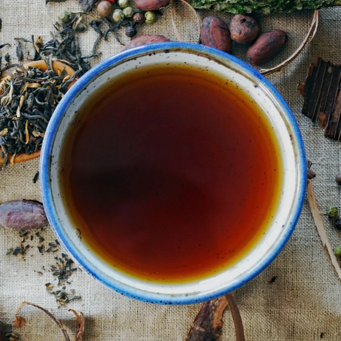white and brown ceramic mug